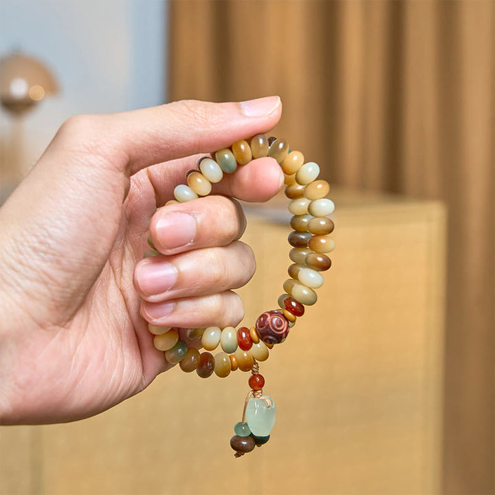 Buddha Stonesカラフルな菩提樹の種 平和の鍵チャーム 知恵のそろばんビーズ ダブルラップブレスレット