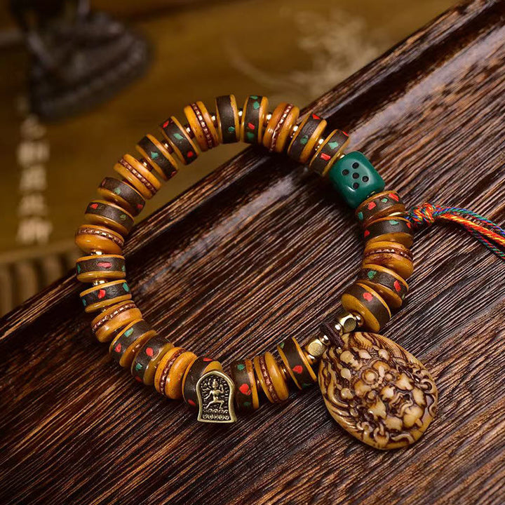 Buddha Stonesチベットラクダ骨サイコロタッセル保護ブレスレット