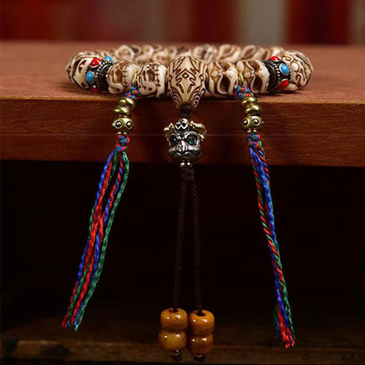 Buddha Stonesチベットラクダ骨ガルーダ彫刻保護タッセルブレスレット
