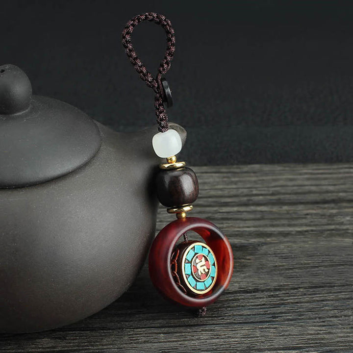 Buddha Stones黒檀四つ葉のクローバー 仏陀の目 平和 回転式キーチェーン - サンスクリット語のパターン - image 0