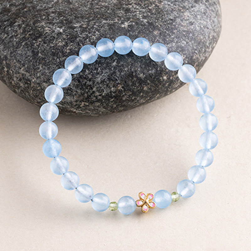 Buddha Stones 天然アクアマリンと金メッキ銅製フラワーヒーリングブレスレット - image 1