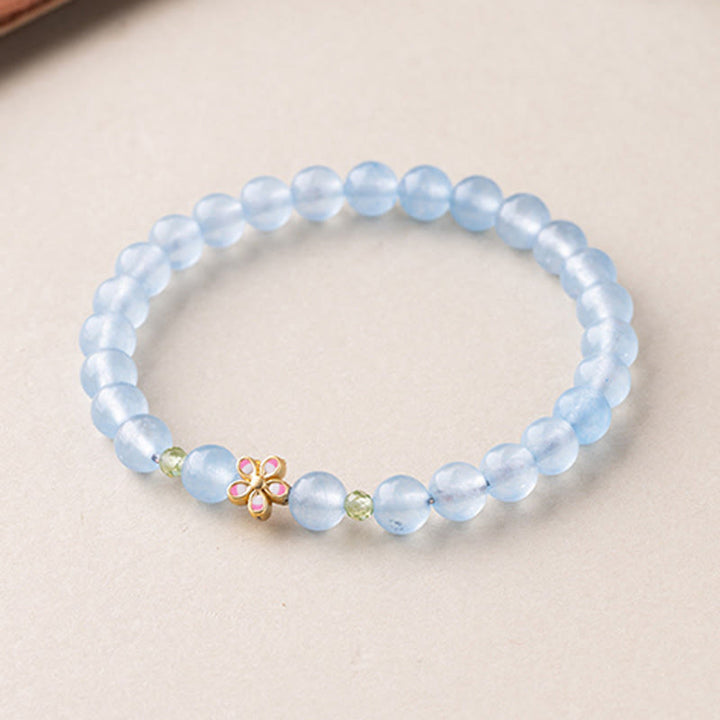 Buddha Stones 天然アクアマリンと金メッキ銅製フラワーヒーリングブレスレット - image 2