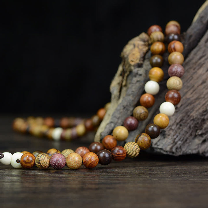 Buddha Stones 108個のビーズ、マルチトーンの天然木製、穏やかなエネルギーマーラー数珠 - image 3