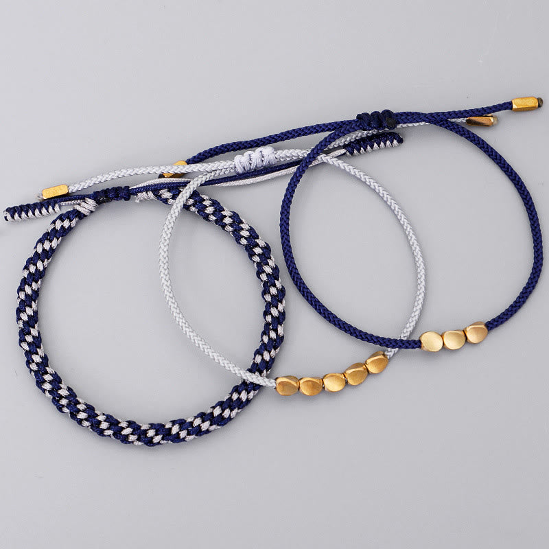 Buddha Stones 青とグレーの糸に金色の銅ビーズをあしらったセルフケアブレスレット（3個セット） - image 1