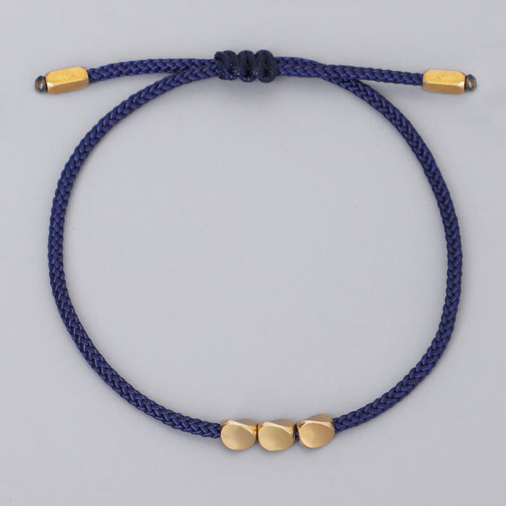 Buddha Stones 青とグレーの糸に金色の銅ビーズをあしらったセルフケアブレスレット（3個セット） - image 2
