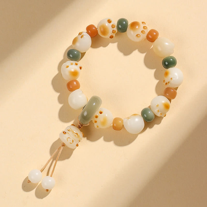 Buddha Stones 天然菩提樹の実入り猫の足跡デザインの開運財運ブレスレット - image 7