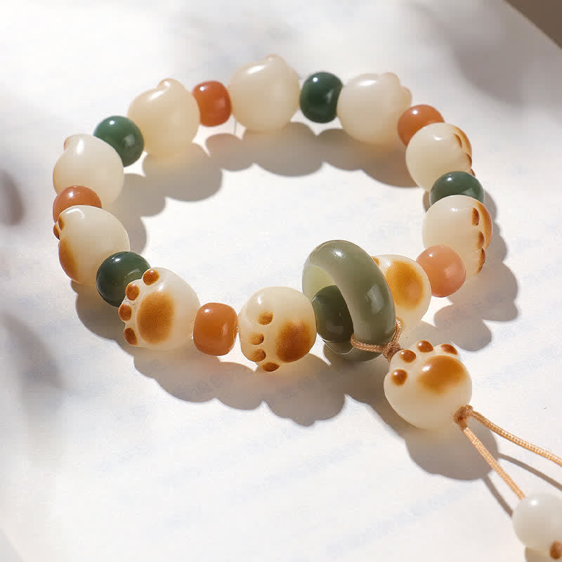 Buddha Stones 天然菩提樹の実入り猫の足跡デザインの開運財運ブレスレット - image 1