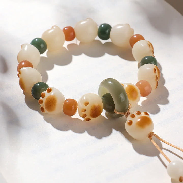 Buddha Stones 天然菩提樹の実入り猫の足跡デザインの開運財運ブレスレット - image 1