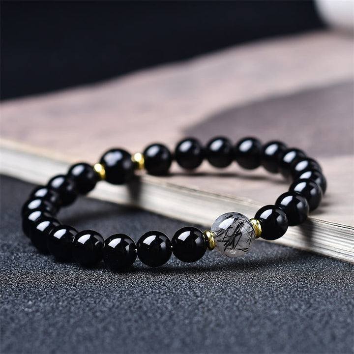 Buddha Stones 天然ブラックオブシディアンとブラックルチルクォーツの浄化ブレスレット - 10mm（手首周り：16～17cm） - image 0