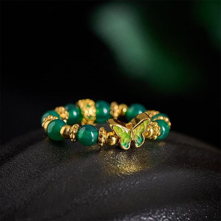 Buddha Stones 天然グリーンアゲートビーズ入り銅製蝶モチーフの結婚指輪 - image 3