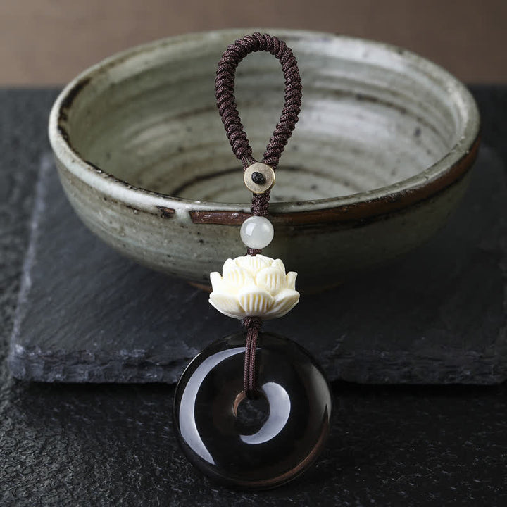 Buddha Stones レインボーオブシディアンロータスピース平和のお守りチャームプロテクションキーホルダー - ロータス - アイスオブシディアン平和のお守りチャームキーホルダー - レインボーオブシディアン（光の当たり方によって色が変わる） - image 1