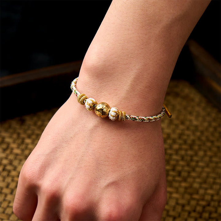 Buddha Stones 白い編み込みロープのオーム・マニ・パドメ・フムの知恵のブレスレット - image 4