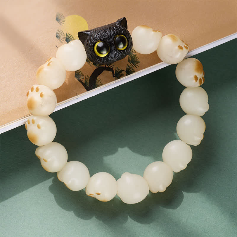 Buddha Stones 菩提樹の実と黒檀で作られた猫の足の形をした、清らかさと知恵を象徴するブレスレット - image 2