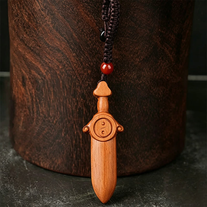 Buddha Stones ナツメ材の陰陽バランス彫刻入り剣型キーホルダー - image 1