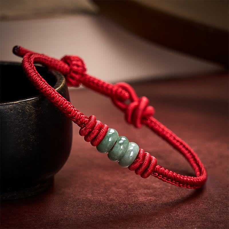 Buddha Stones 手作りの赤紐と翡翠を使った、保護を象徴する編み込みスライドノットブレスレット - image 1
