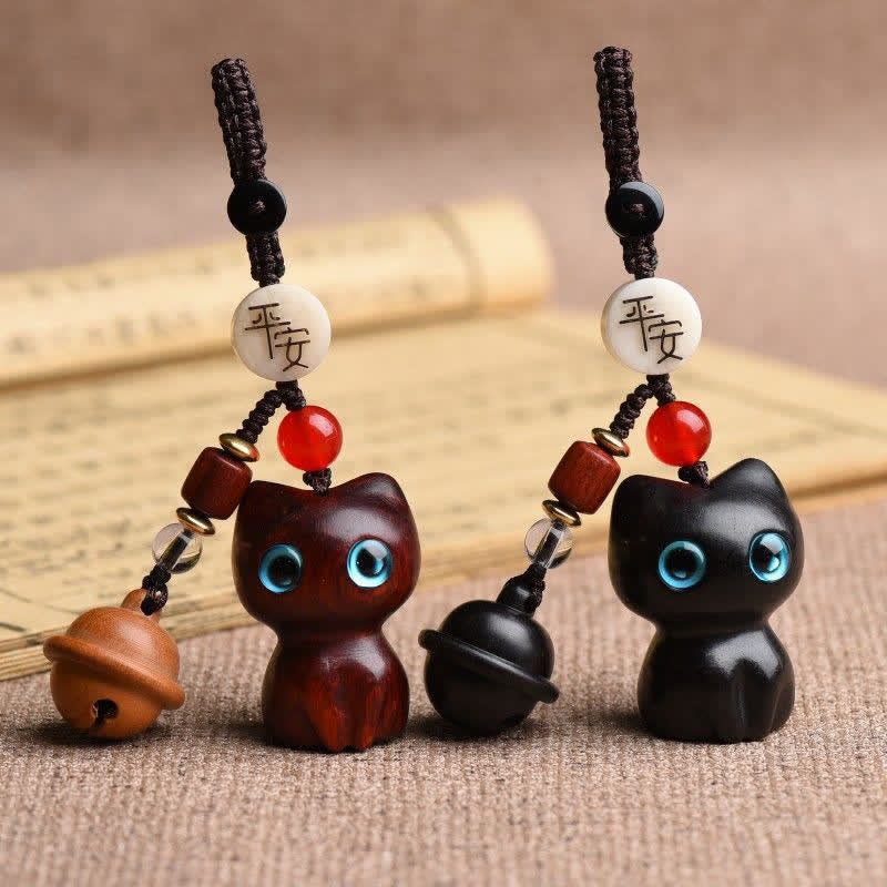 Buddha Stones 黒檀と赤檀の手彫り猫鈴付きお守りキーホルダー - image 0