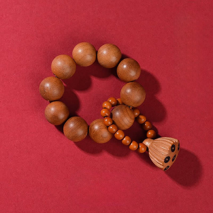 Buddha Stones 桃の木の蓮の実を模した、手磨き仕上げの触覚的な瞑想ビーズ装飾品 - 桃の木（守護♥浄化） - image 1