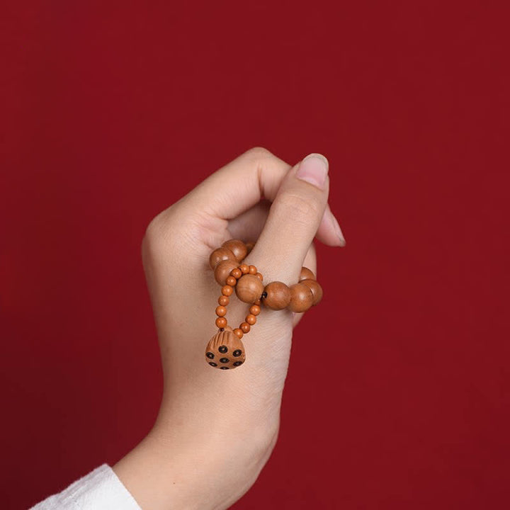 Buddha Stones 桃の木の蓮の実を模した、手磨き仕上げの触覚的な瞑想ビーズ装飾品 - image 2