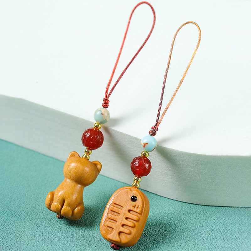 Buddha Stones 手彫りの白檀製猫魚浄化キーホルダー - image 9