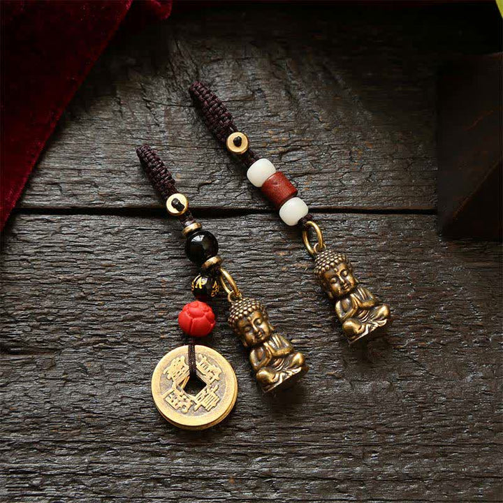 Buddha Stones 真鍮製仏像五帝銭編み紐慈悲キーホルダー - image 0