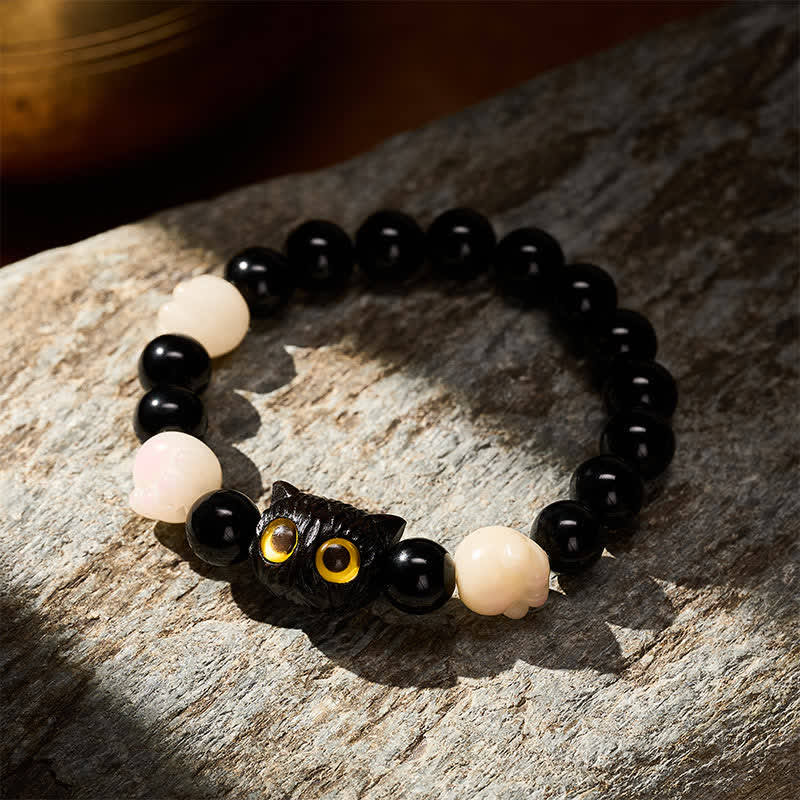Buddha Stones 手彫りの黒曜石製、黄色い目の猫の頭をモチーフにしたグラウンディングビーズブレスレット - image 2