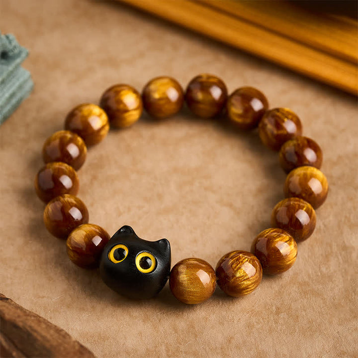 Buddha Stones 黄色の樹脂ビーズ、黄色の目、黒檀猫モチーフの落ち着いたブレスレット - 14mm（手首周り：7.1～7.5インチ／18～19cm） - image 0