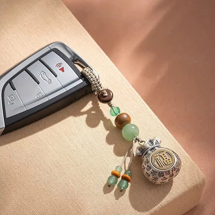 Buddha Stones 銅製の福の文字をモチーフにした手織りの良縁祈願バッグとビーズのキーホルダー - image 3