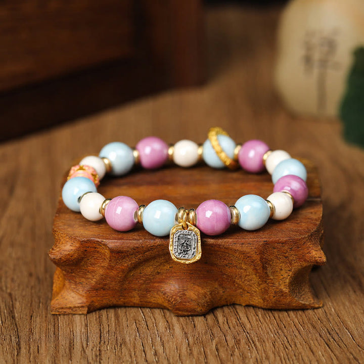 Buddha Stonesチベットのザキラム女神 富の女神 ウサギ ライオンヘッドチャーム リュウリガラスインセンス 灰磁器ビーズ 保護ブレスレット