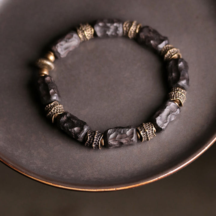 Buddha Stonesチベット黒檀 銅 穏やかで平和なブレスレット