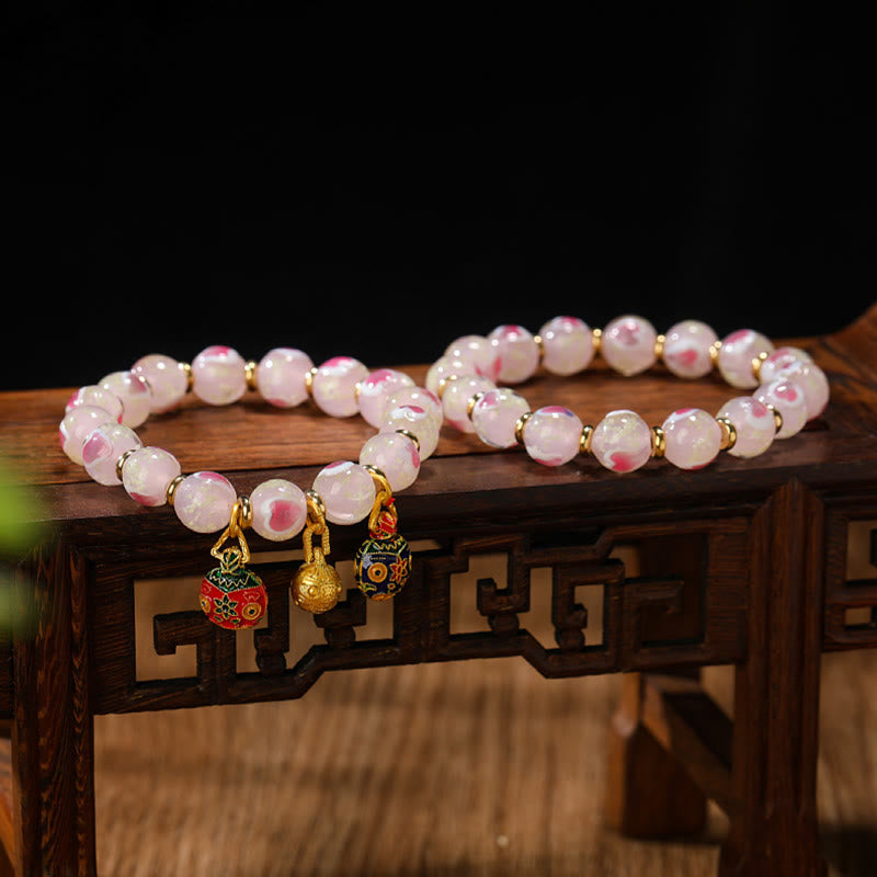 Buddha Stonesゴールド 呑み込み獣 ファミリーチャーム 光るピンク ラブハート 蛍光 Liuli ガラスビーズ 祝福ブレスレット