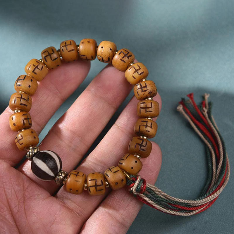 Buddha Stones天然チベットラクダ骨卍 Dzi ビーズ Shankha 仏陀チャーム Kirtimukha 幸運保護タッセルブレスレット
