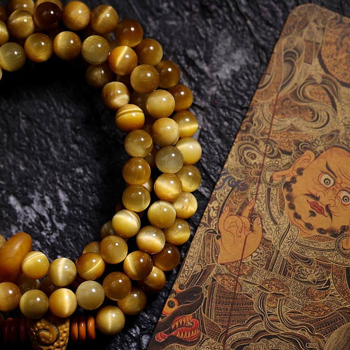 Buddha Stones 108Mala天然タイガーアイ 銅製 ドルジェ 守護 タッセルブレスレット