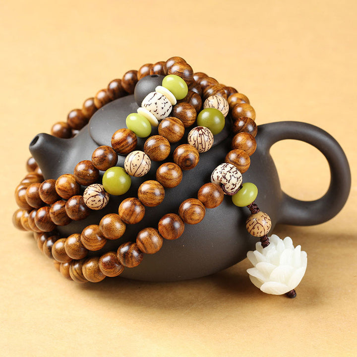 Buddha Stonesチベットローズウッド蓮のMala保護鎮静ネックレスブレスレット