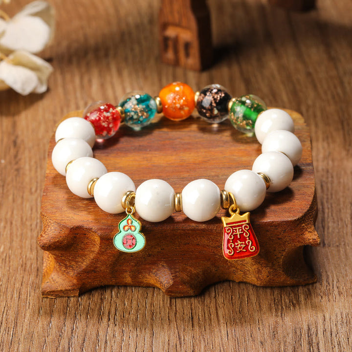 Buddha Stonesチベットのお香 灰磁器 蛍光 リュウリガラスビーズ ひょうたん 銅貨 チャーム 平和ブレスレット