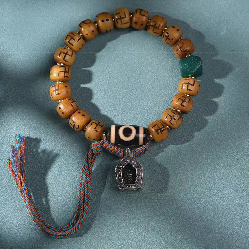 Buddha Stones天然チベットラクダ骨卍 Dzi ビーズ Shankha 仏陀チャーム Kirtimukha 幸運保護タッセルブレスレット