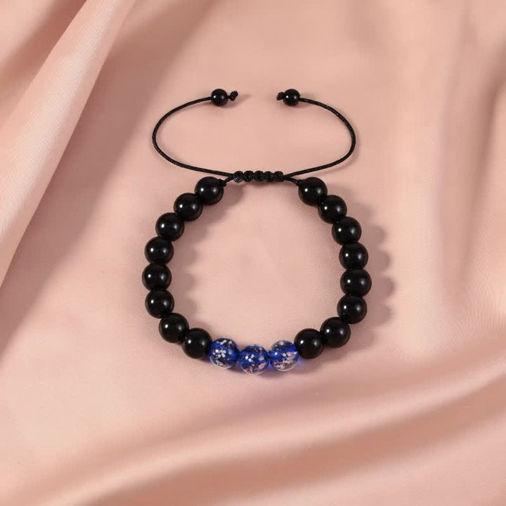 Buddha Stonesブラックオブシディアン 光るグロウストーン 強さのブレスレット