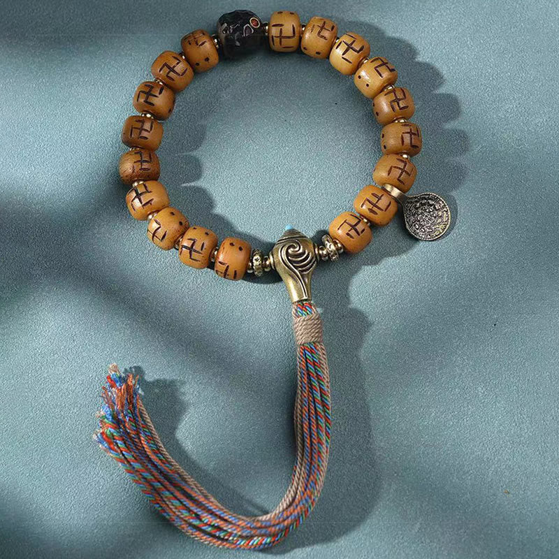 Buddha Stones天然チベットラクダ骨卍 Dzi ビーズ Shankha 仏陀チャーム Kirtimukha 幸運保護タッセルブレスレット
