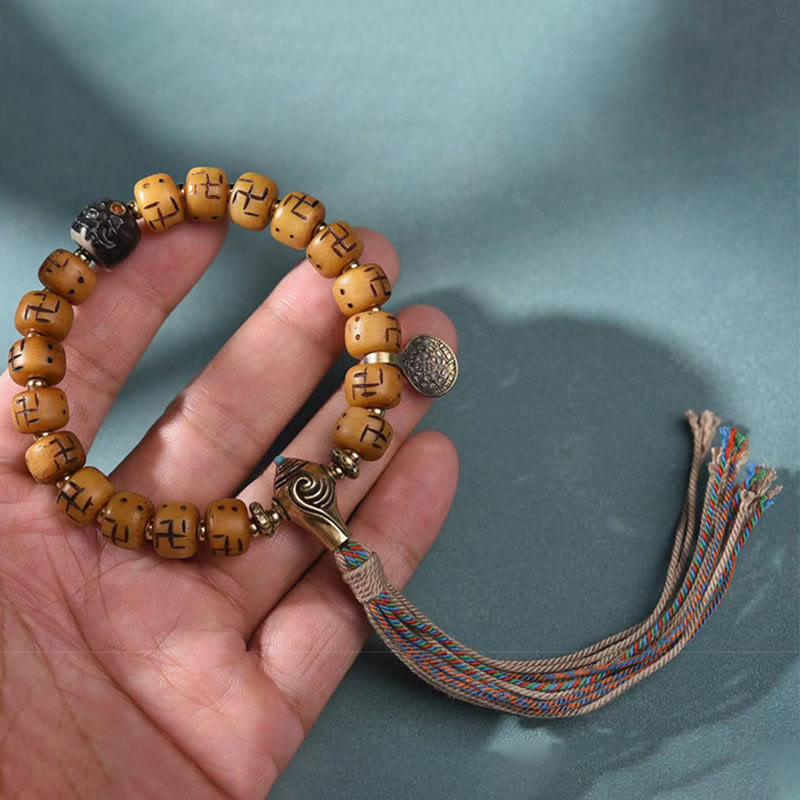 Buddha Stones天然チベットラクダ骨卍 Dzi ビーズ Shankha 仏陀チャーム Kirtimukha 幸運保護タッセルブレスレット