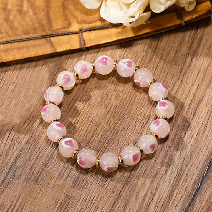 Buddha Stonesゴールド 呑み込み獣 ファミリーチャーム 光るピンク ラブハート 蛍光 Liuli ガラスビーズ 祝福ブレスレット
