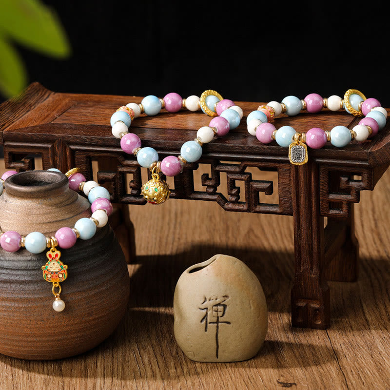 Buddha Stonesチベットのザキラム女神 富の女神 ウサギ ライオンヘッドチャーム リュウリガラスインセンス 灰磁器ビーズ 保護ブレスレット