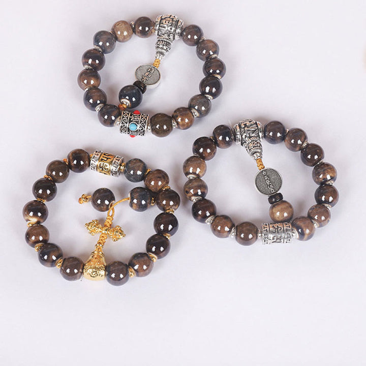 チベットのBuddha Stones、オーム・マニ・パドメ・フムの祈祷ホイール、ドルジェ・ヴァジュラの彫刻入りガラスビーズの知恵のブレスレット