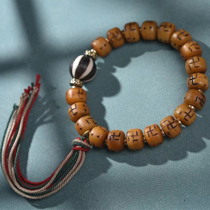 Buddha Stones天然チベットラクダ骨卍 Dzi ビーズ Shankha 仏陀チャーム Kirtimukha 幸運保護タッセルブレスレット