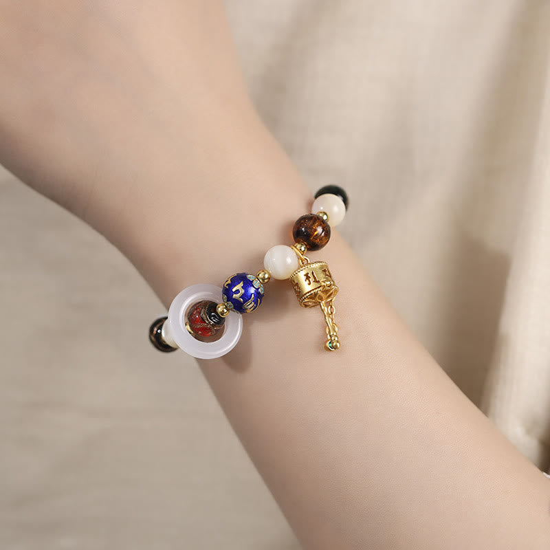 Buddha Stonesチベットのお香灰 リュウリガラス シャコガイ石 太陽石オーム・マニ・パドメ・フム祈祷ホイールチャームブレスレット