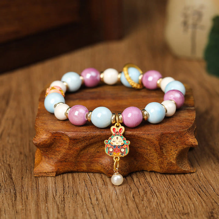 Buddha Stonesチベットのザキラム女神 富の女神 ウサギ ライオンヘッドチャーム リュウリガラスインセンス 灰磁器ビーズ 保護ブレスレット
