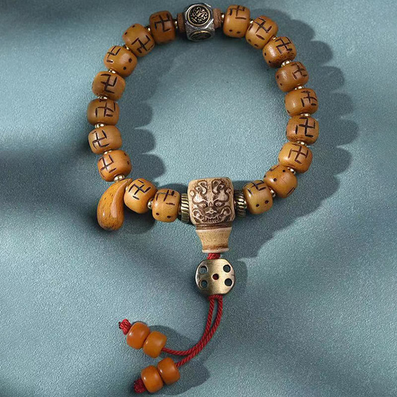 Buddha Stones天然チベットラクダ骨卍 Dzi ビーズ Shankha 仏陀チャーム Kirtimukha 幸運保護タッセルブレスレット
