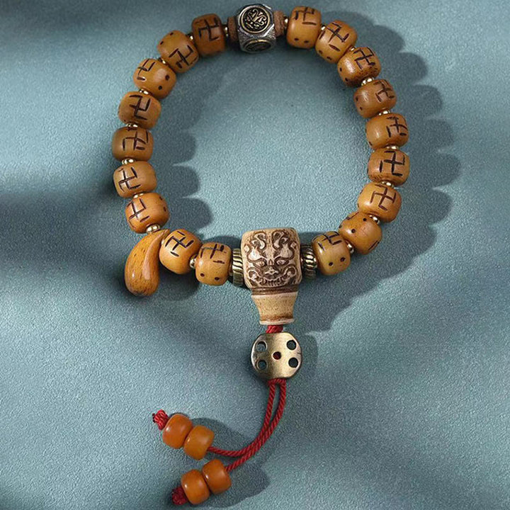 Buddha Stones天然チベットラクダ骨卍 Dzi ビーズ Shankha 仏陀チャーム Kirtimukha 幸運保護タッセルブレスレット