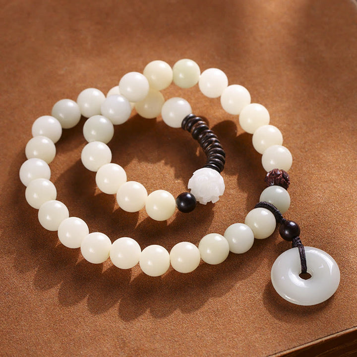 Buddha Stonesの種 グリーンサンダルウッド 蓮の平和のお守りチャームハーモニー ダブルラップブレスレット