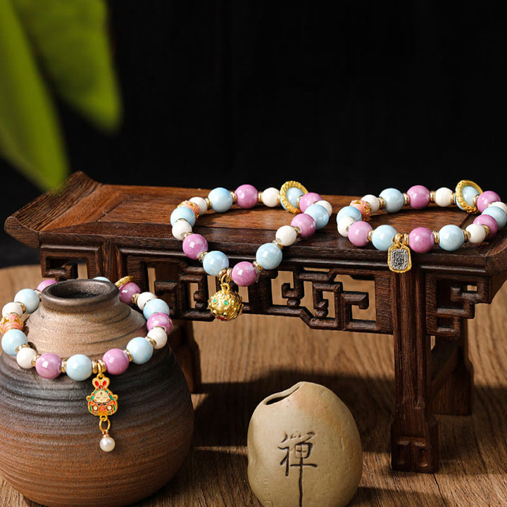 Buddha Stonesチベットのザキラム女神 富の女神 ウサギ ライオンヘッドチャーム リュウリガラスインセンス 灰磁器ビーズ 保護ブレスレット