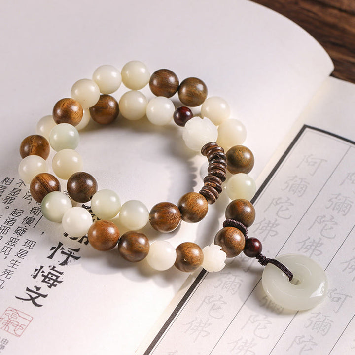 Buddha Stonesの種 グリーンサンダルウッド 蓮の平和のお守りチャームハーモニー ダブルラップブレスレット