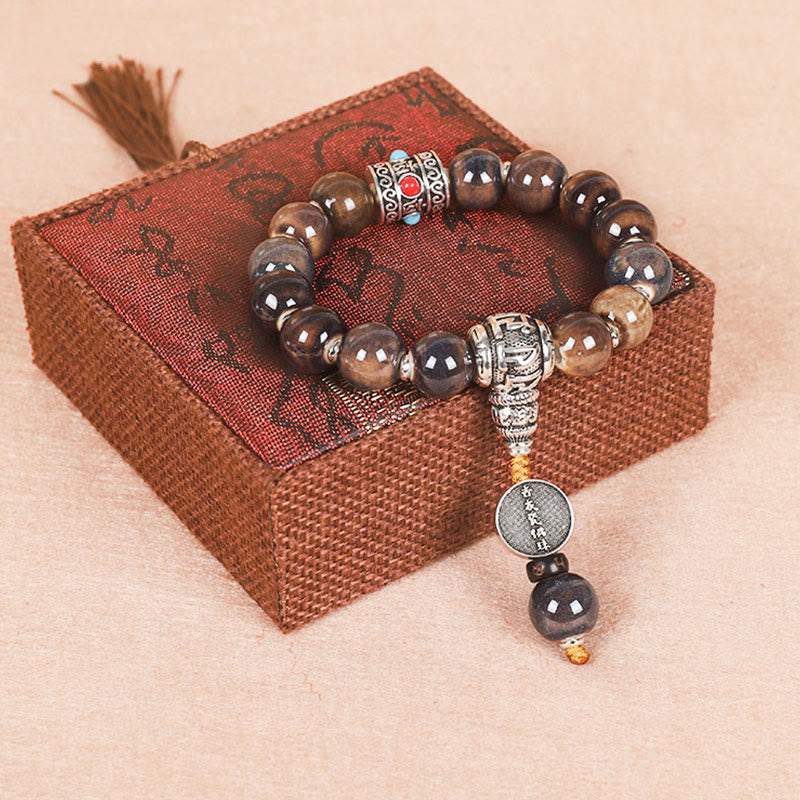 チベットのBuddha Stones、オーム・マニ・パドメ・フムの祈祷ホイール、ドルジェ・ヴァジュラの彫刻入りガラスビーズの知恵のブレスレット